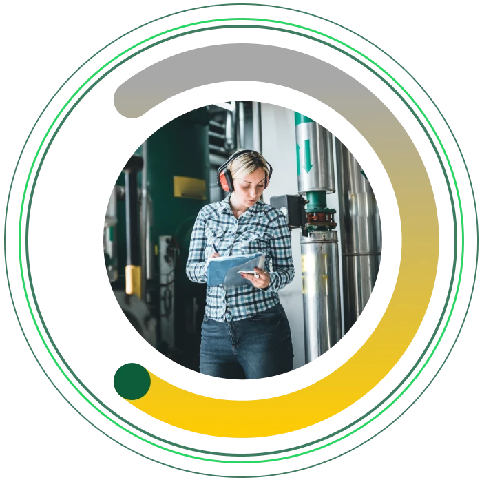 A female engineer in a plant room, framed within the asme brand semi circle graphic.