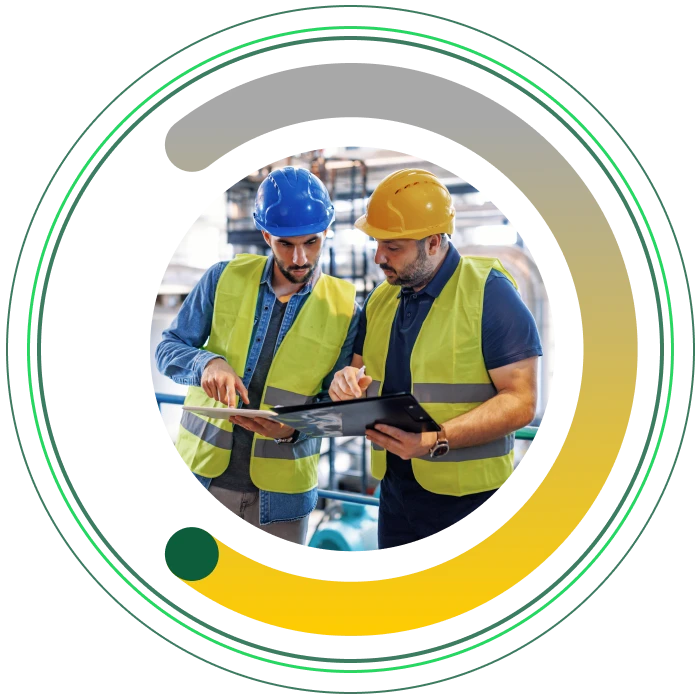 Two engineers discussing a project on site, framed within the asme brand semi circle.