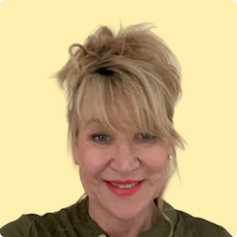 Jeanne, a white female with blond hair, smiling at the camera, on a yellow background.