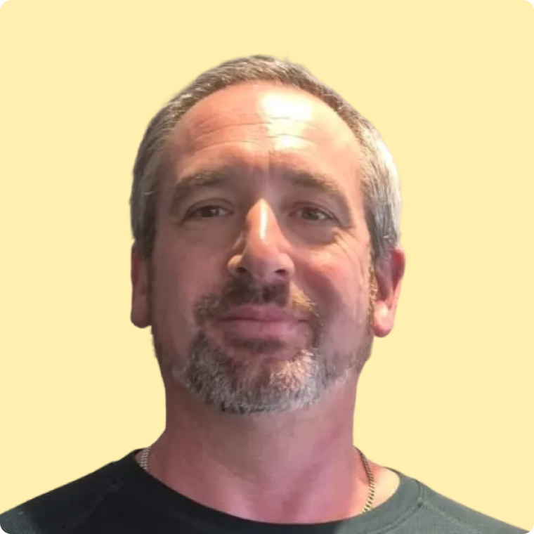 Mark, a white male with beard, smiling at the camera.