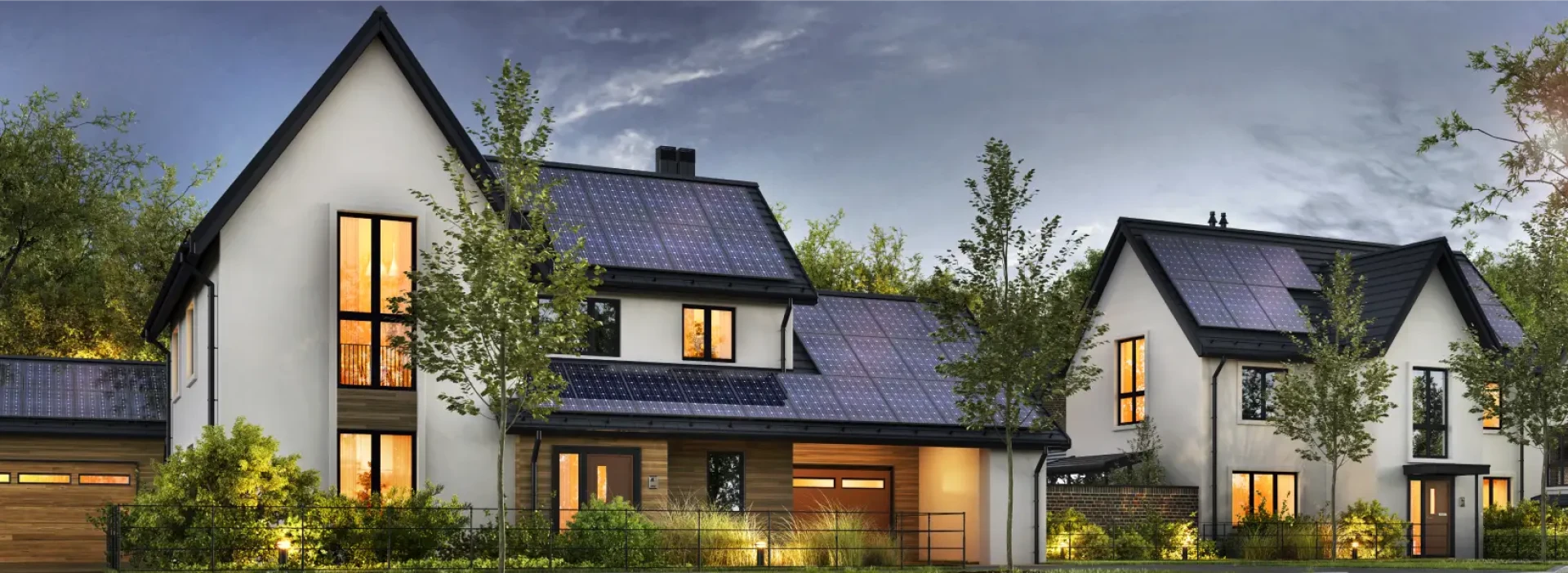 2 beautiful modern smart homes with solar panels, side by side on a street with trees.